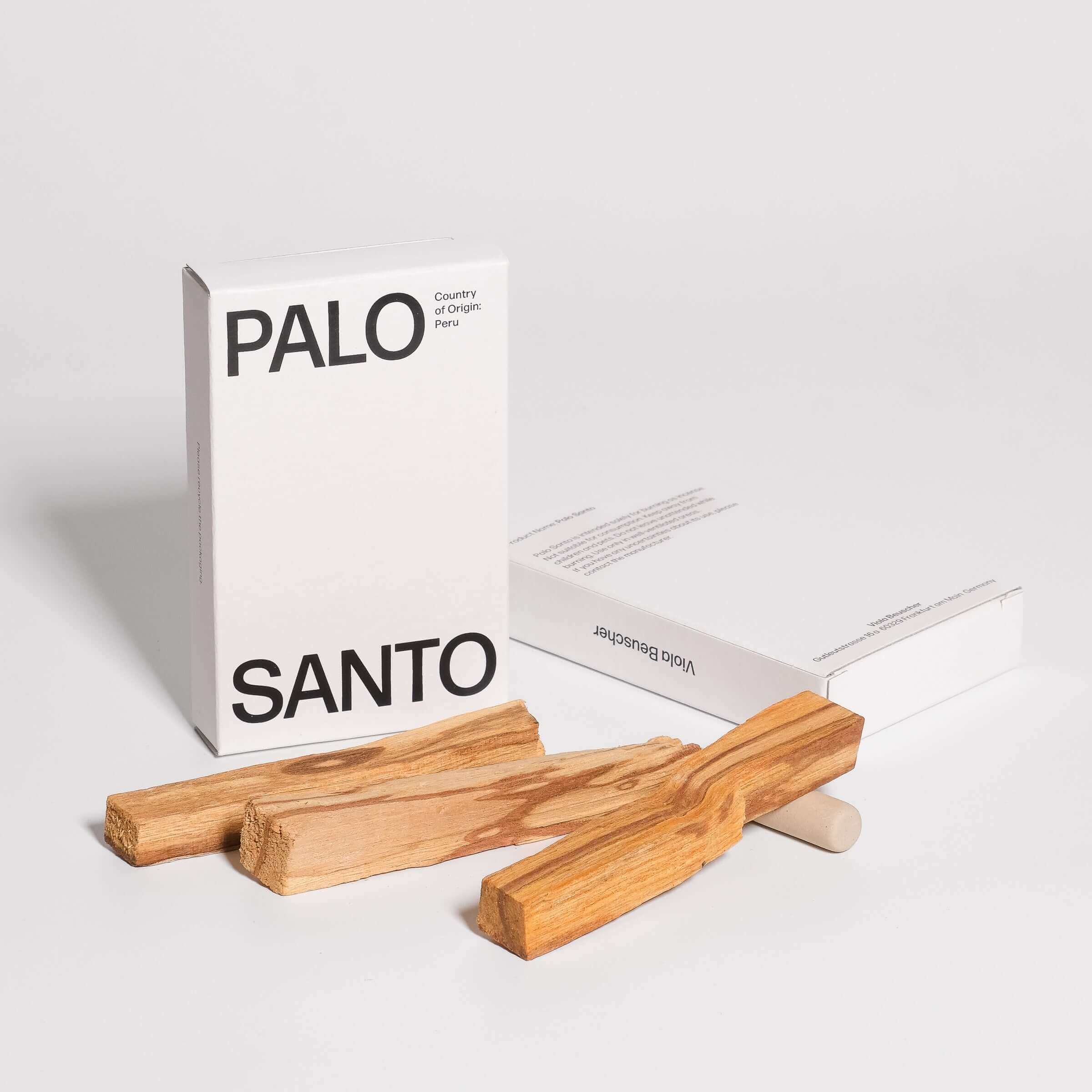 Palo Santo sticks with white packaging labeled 'PALO SANTO', sustainably sourced from Peru.