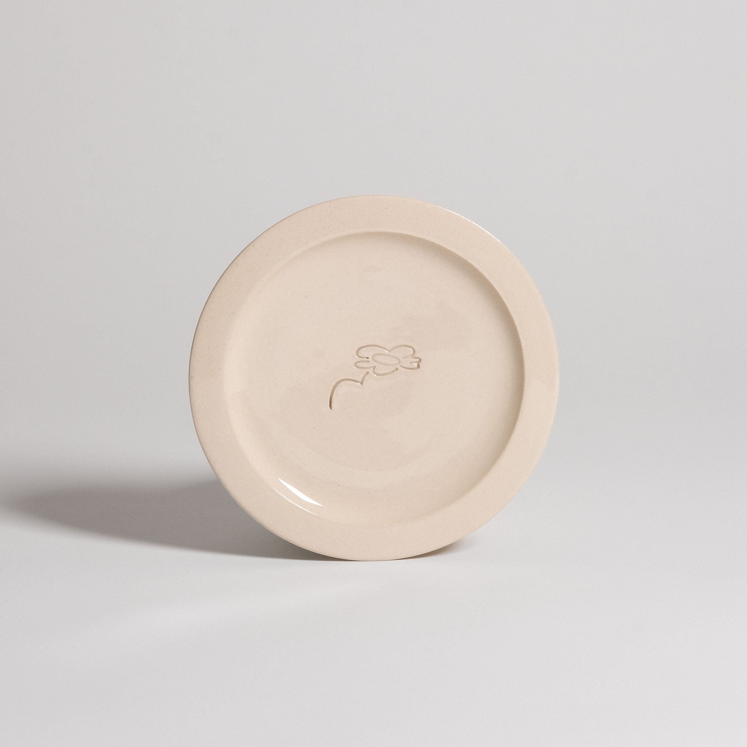 Handcrafted Neo Creme bistro plate, stoneware ceramic with embossed logo, dishwasher and oven safe.