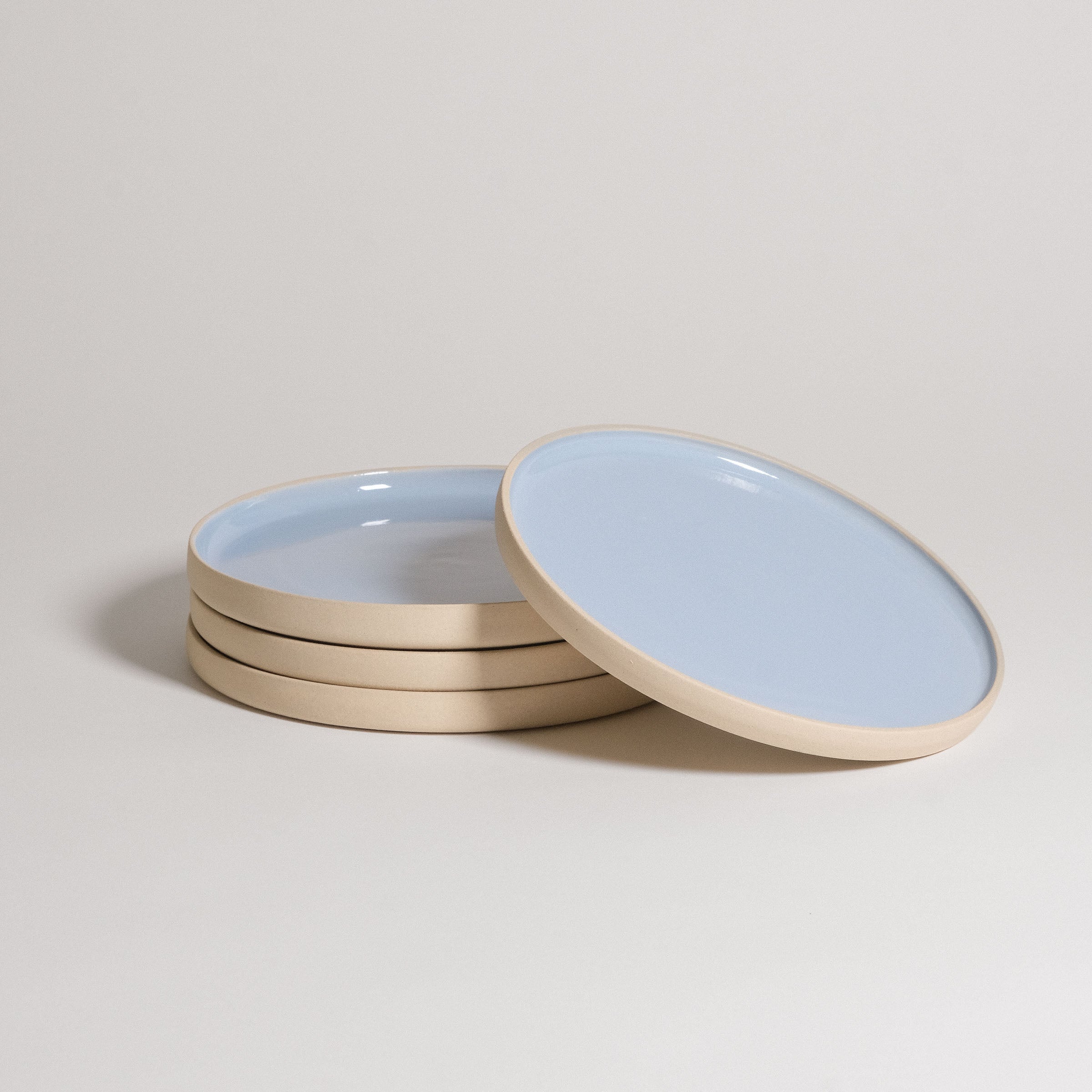 Mix & Match - Plate Bundle featuring blue and beige plates stacked together, perfect for creating a custom tableware set.