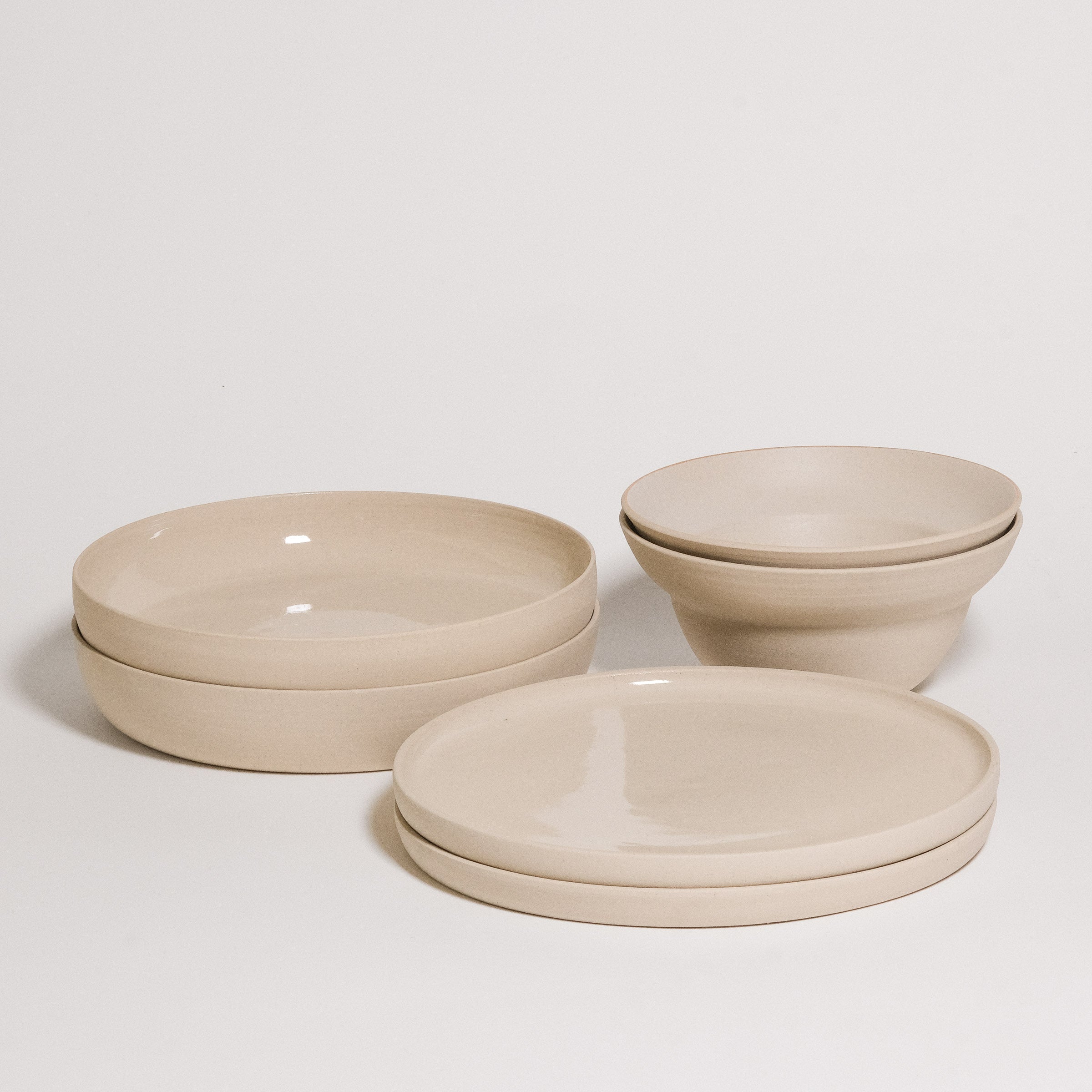 Mix & Match - Tableware Bundle featuring stacked bowls and plates in neutral tones.