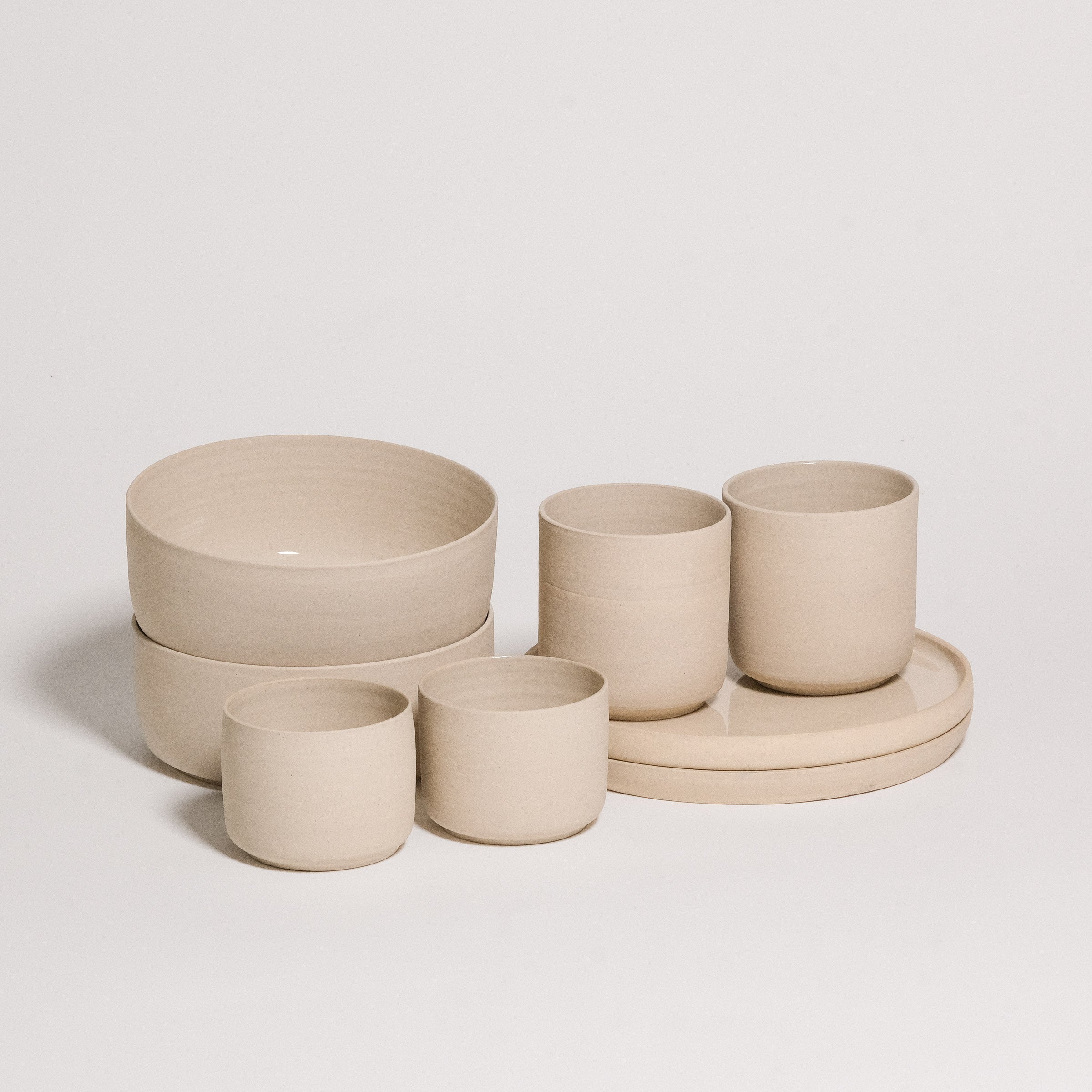 Mix & Match - Tableware Bundle featuring elegant beige bowls and cups for customizable dining experience.