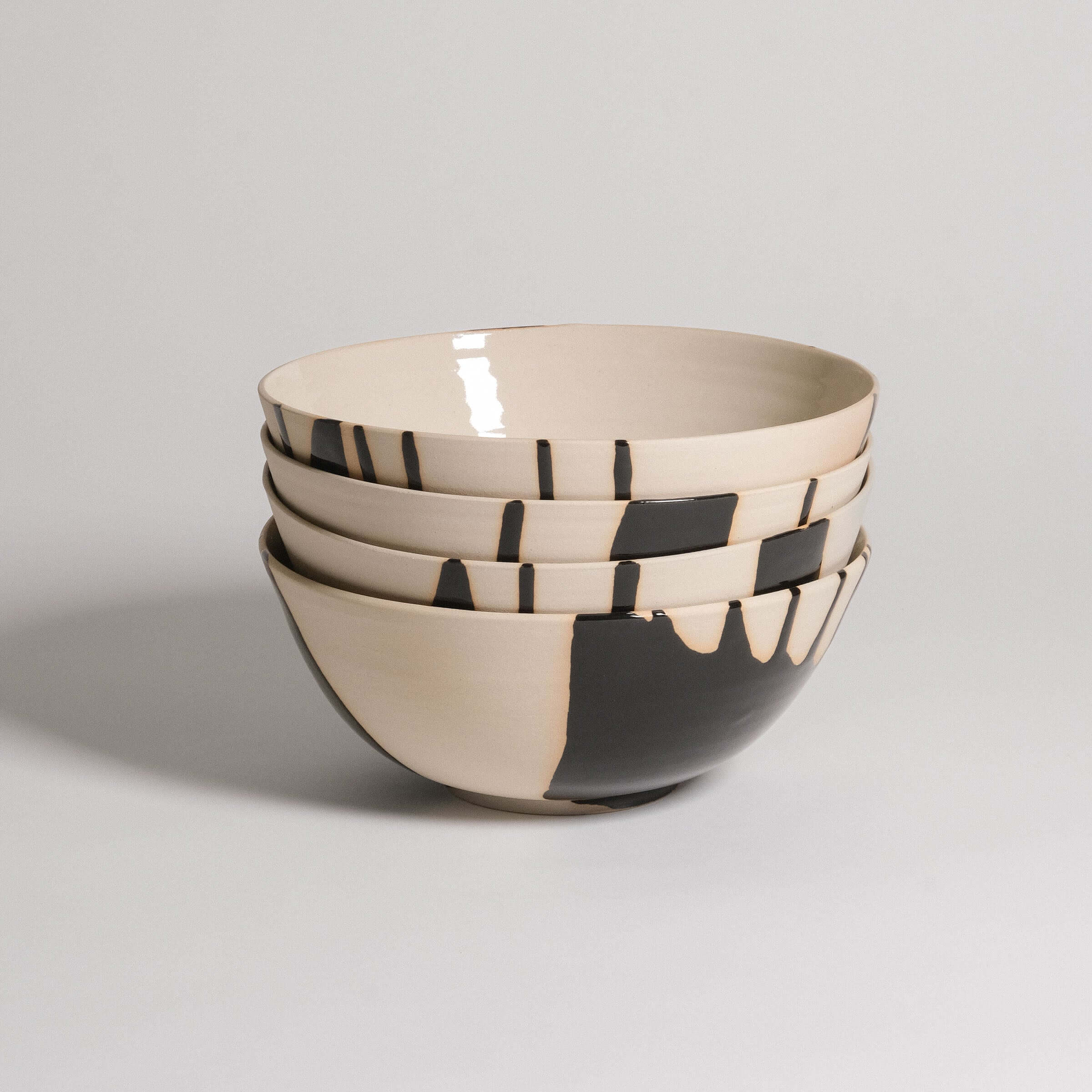 Set of 4 grey stoneware ramen bowls with glossy black and transparent glazes, perfect for serving and enjoying meals.