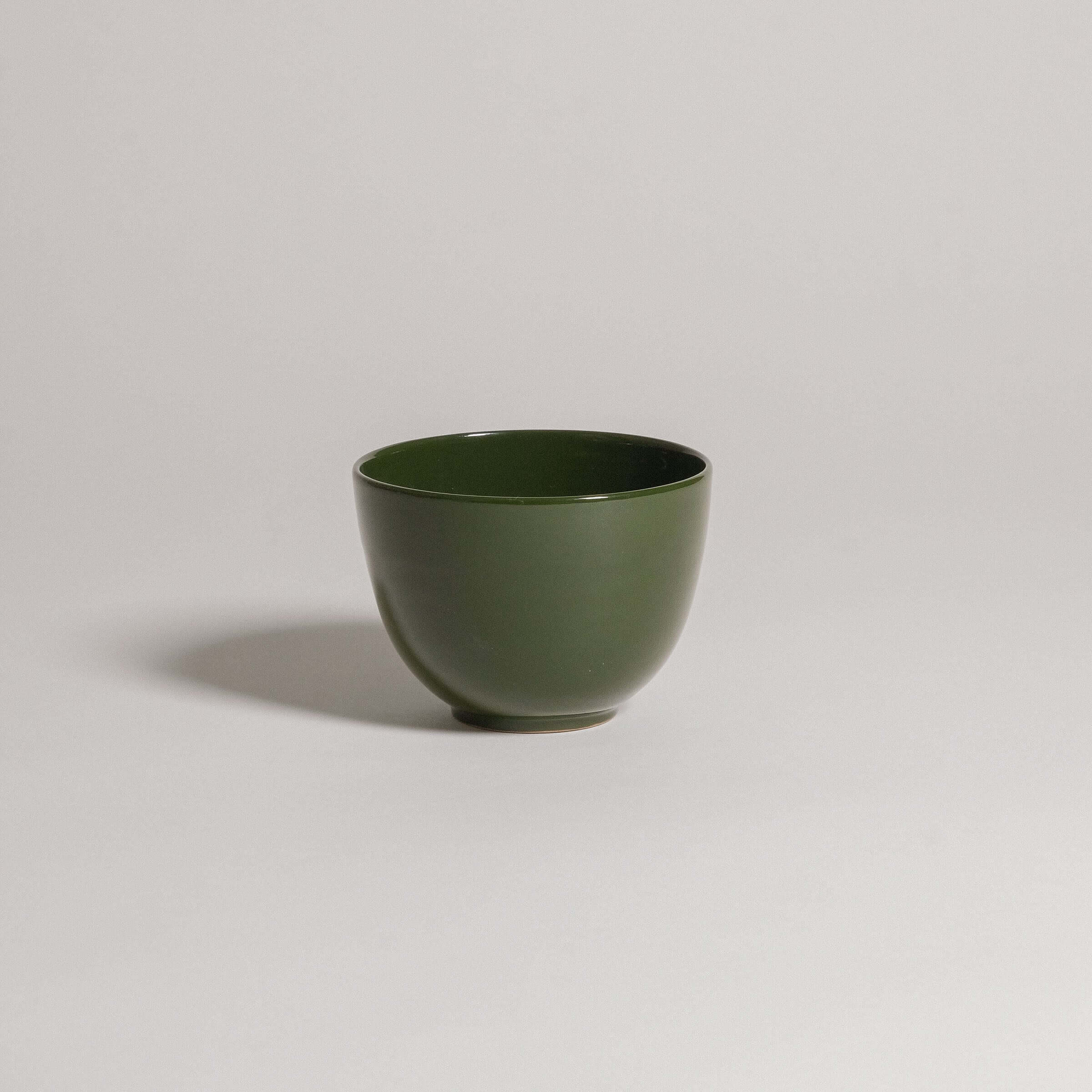 Handcrafted Yun Green coffee cup, made of durable stoneware ceramic with a unique glaze finish.