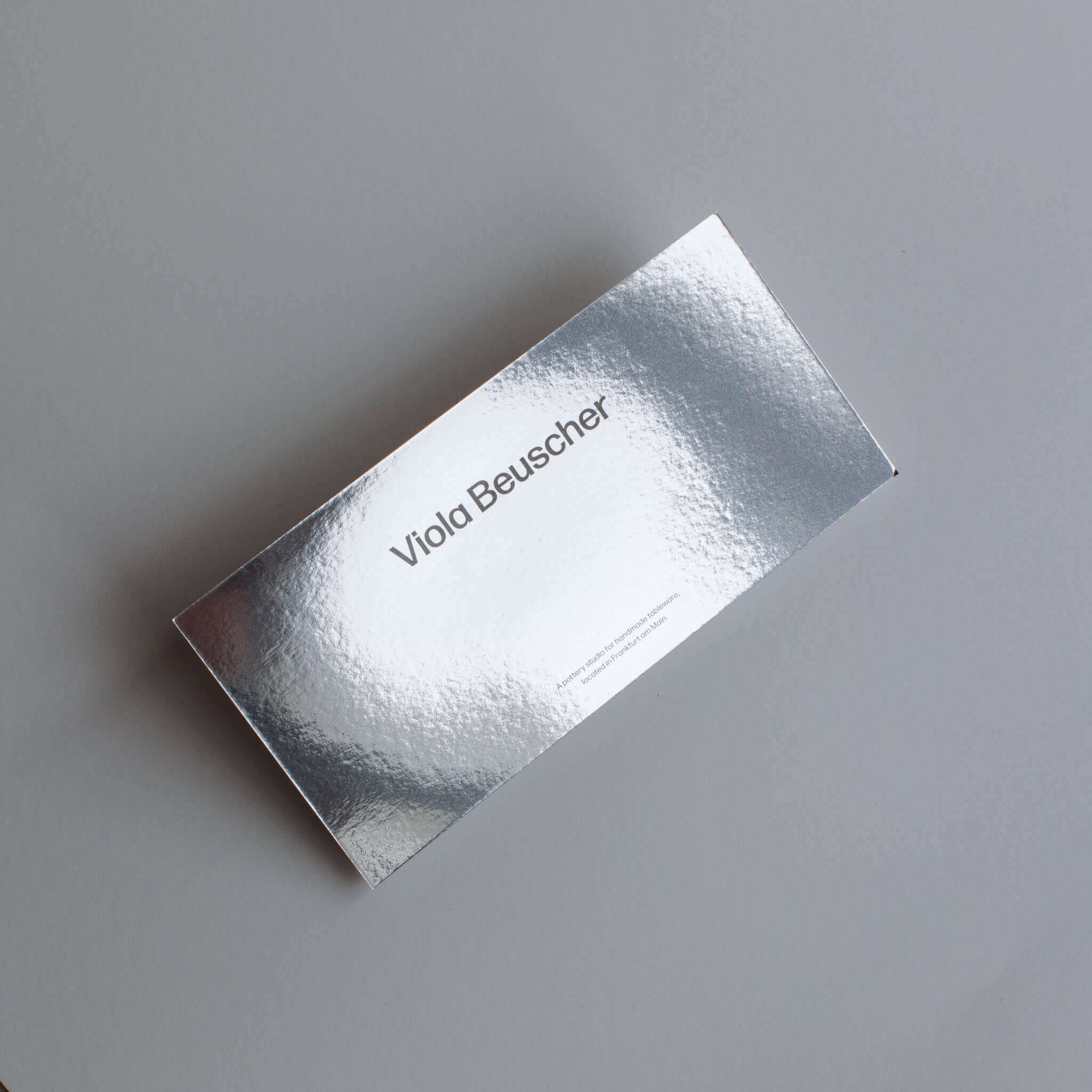 Silver gift voucher for Viola Beuscher, featuring a sleek design, ideal for pottery enthusiasts.