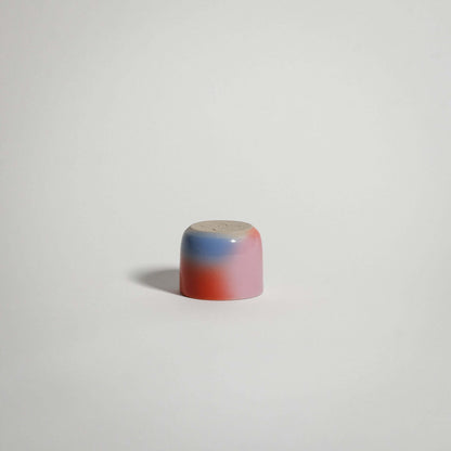 Dawn Espresso Cup handcrafted from grey stoneware with red, blue, and lilac gradient glaze, perfect for espresso.