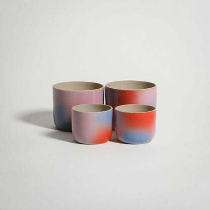 Dawn Espresso & Coffee Cup Set of four handcrafted stoneware cups in red, blue, and lilac gradient finish.