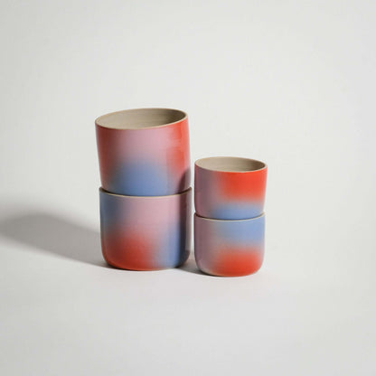 Dawn Espresso & Coffee Cup Set of four handcrafted stoneware cups in red, blue, and lilac gradient finish.