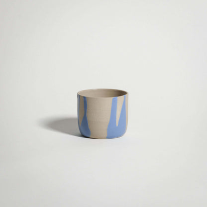 Handcrafted blue stoneware coffee cup with glossy glaze, perfect for tea or warm beverages.