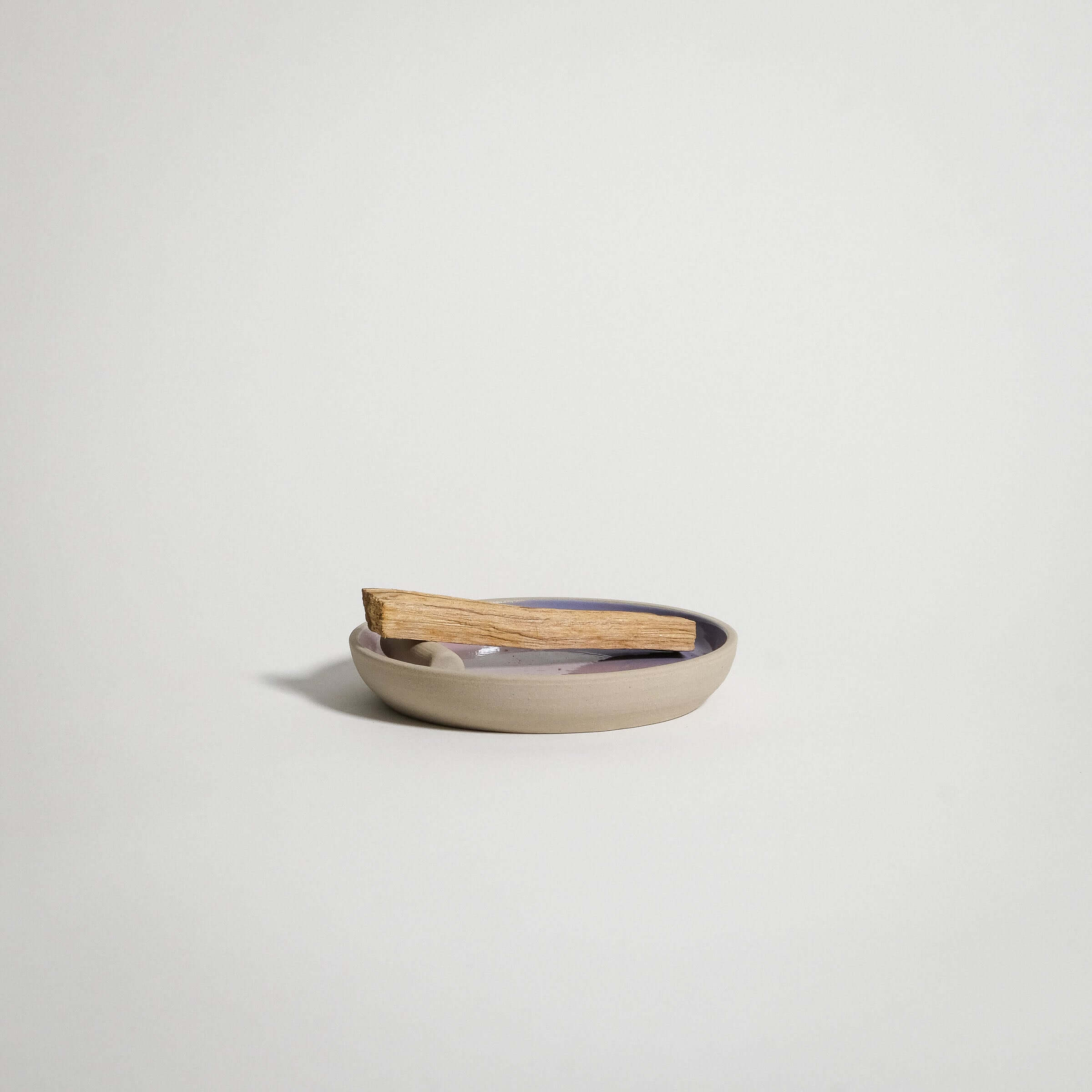 Handcrafted lilac and pink stoneware catch all plate with palo santo, perfect for cups or decorative use.