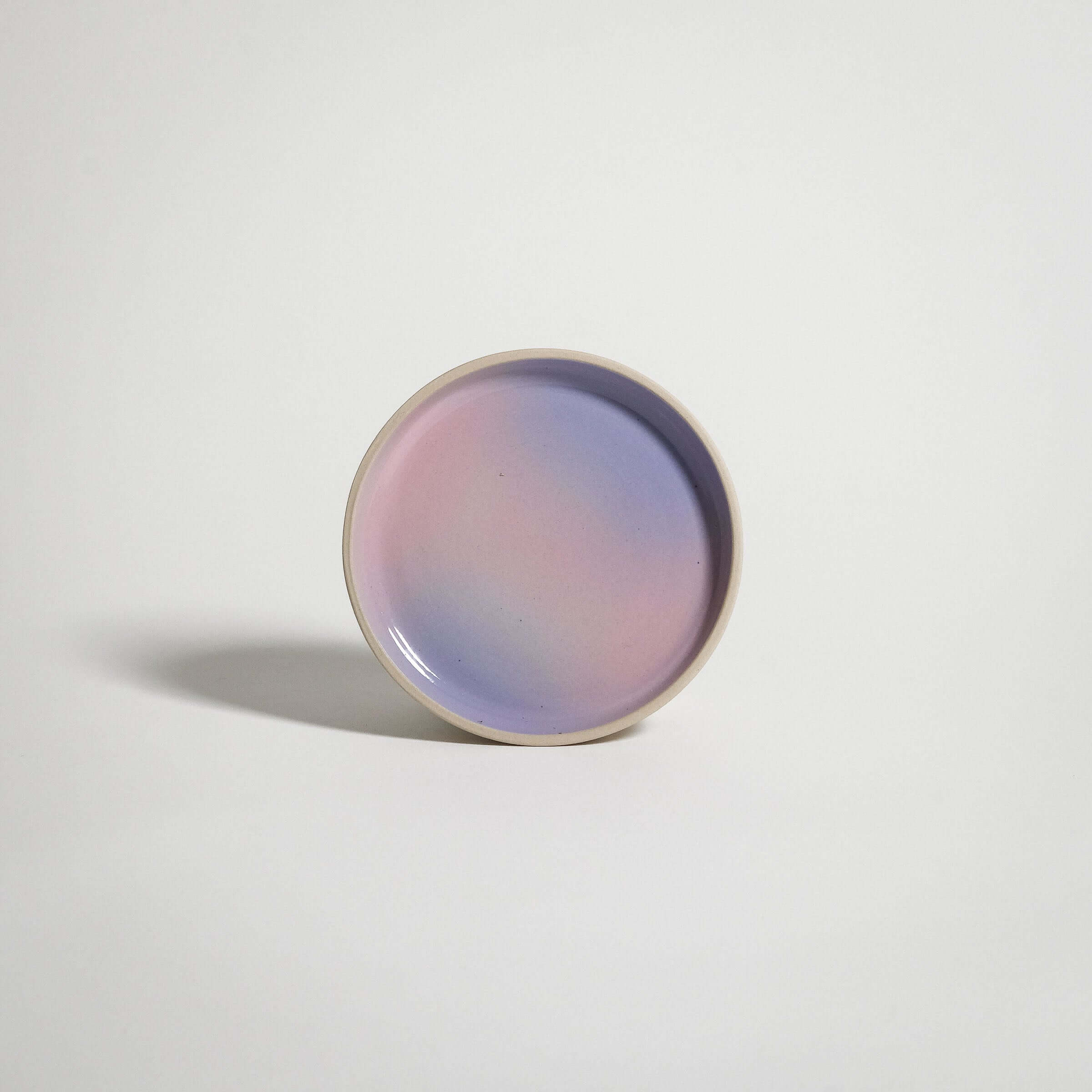 Wheel-thrown small plate in lilac and pink gradient, handcrafted from grey stoneware clay.