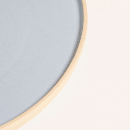 Handcrafted medium dinner plate in iceblue, featuring a durable stoneware ceramic with natural glaze.