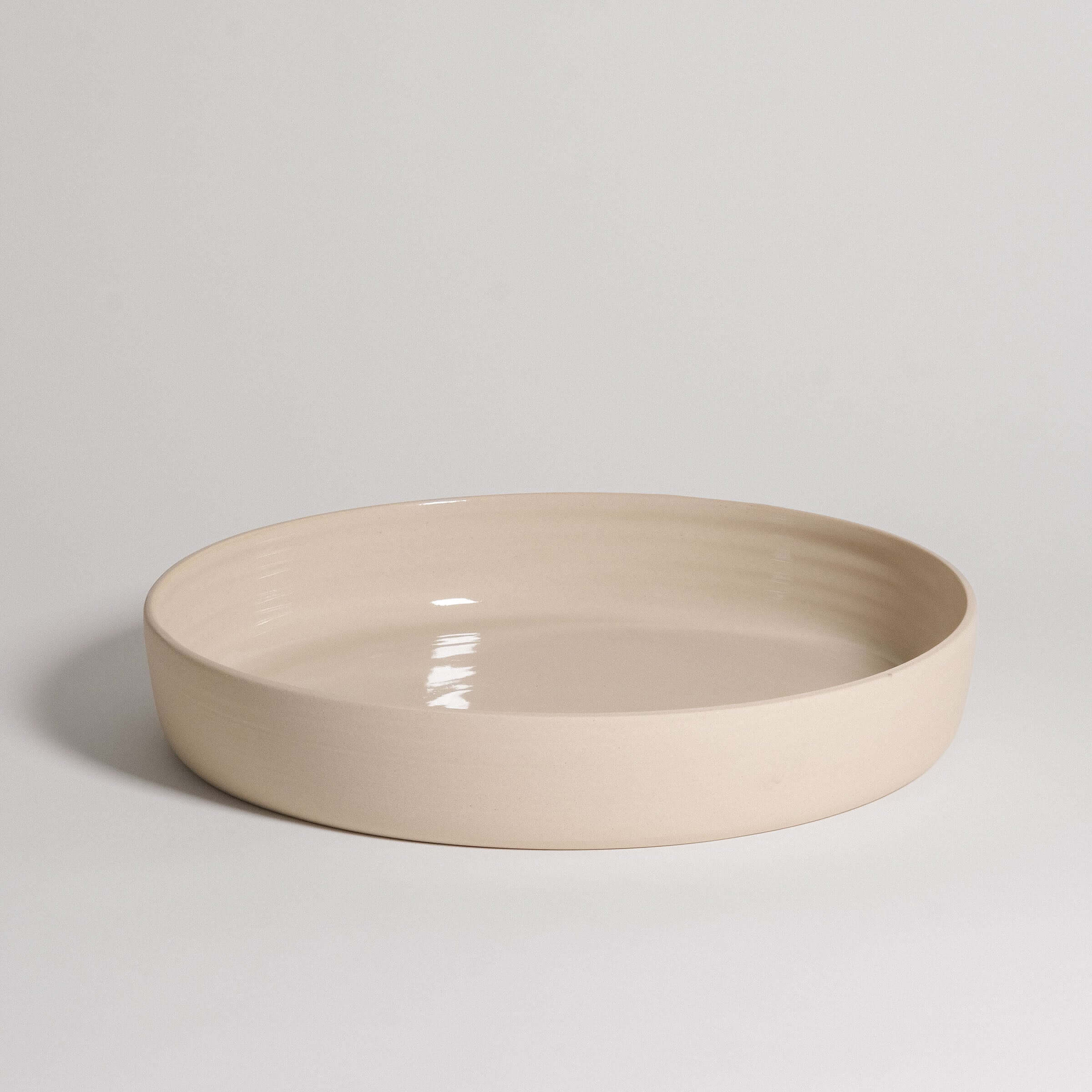 Handmade cream serving bowl made from high-quality stoneware with glossy finish, dishwasher and oven safe.