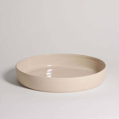 Handmade cream serving bowl made from high-quality stoneware with glossy finish, dishwasher and oven safe.