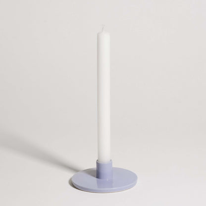 Candle Holder – Lilac displaying a white candle on a soft lilac base, perfect for contemporary interiors.
