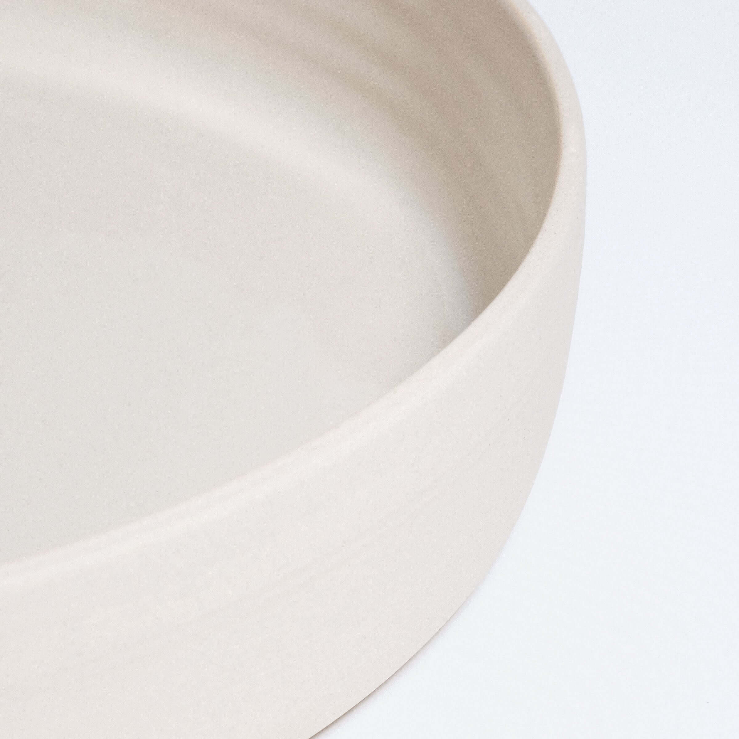 Handmade creme serving bowl made of high-quality stoneware with smooth, glossy finish.