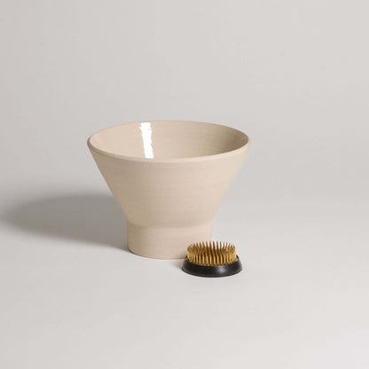 Ikebana vase and kenzan set made of grey stoneware with glossy interior and raw exterior.