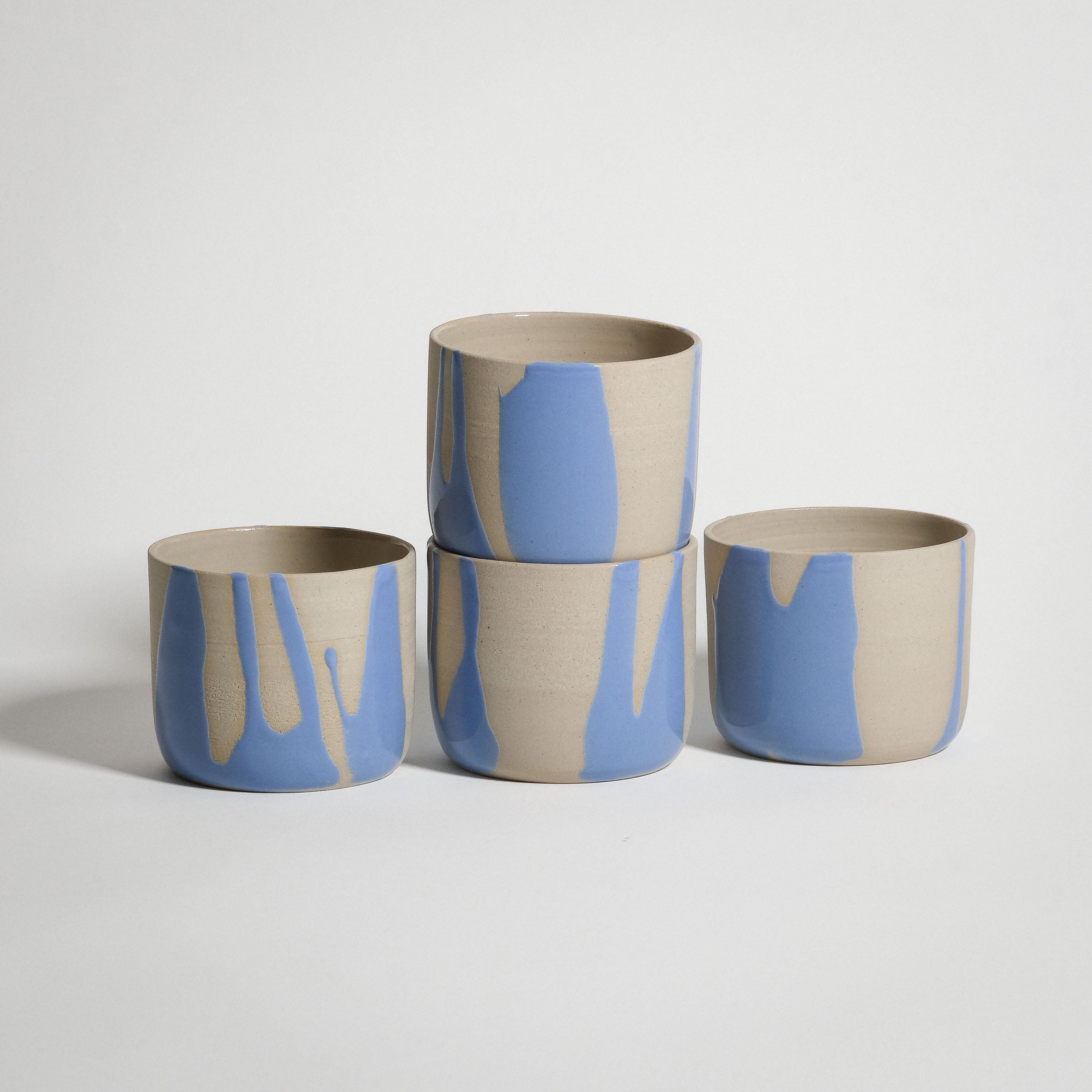 Mix & Match - Cup & Mug Bundle featuring four stylish cups with blue and beige glaze design.