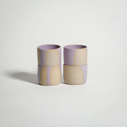 Set of 4 handcrafted espresso cups in Splash Lilac, showcasing a glossy pink and beige glaze design.