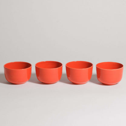 Set of 4 flat white cups in glossy red glaze, made from grey stoneware clay, perfect for coffee drinks.