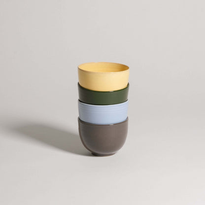 Set of 4 unique coffee cups in yellow, green, ice blue, and brown, handcrafted ceramic, dishwasher and food-safe.