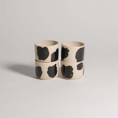 Set of 4 wheel-thrown coffee cups in grey stoneware, hand-painted glossy black brush strokes on the exterior.