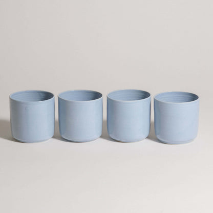 Set of 4 Nomi Iceblue handcrafted tea cups in durable ceramic, showcasing a unique iceblue glaze.