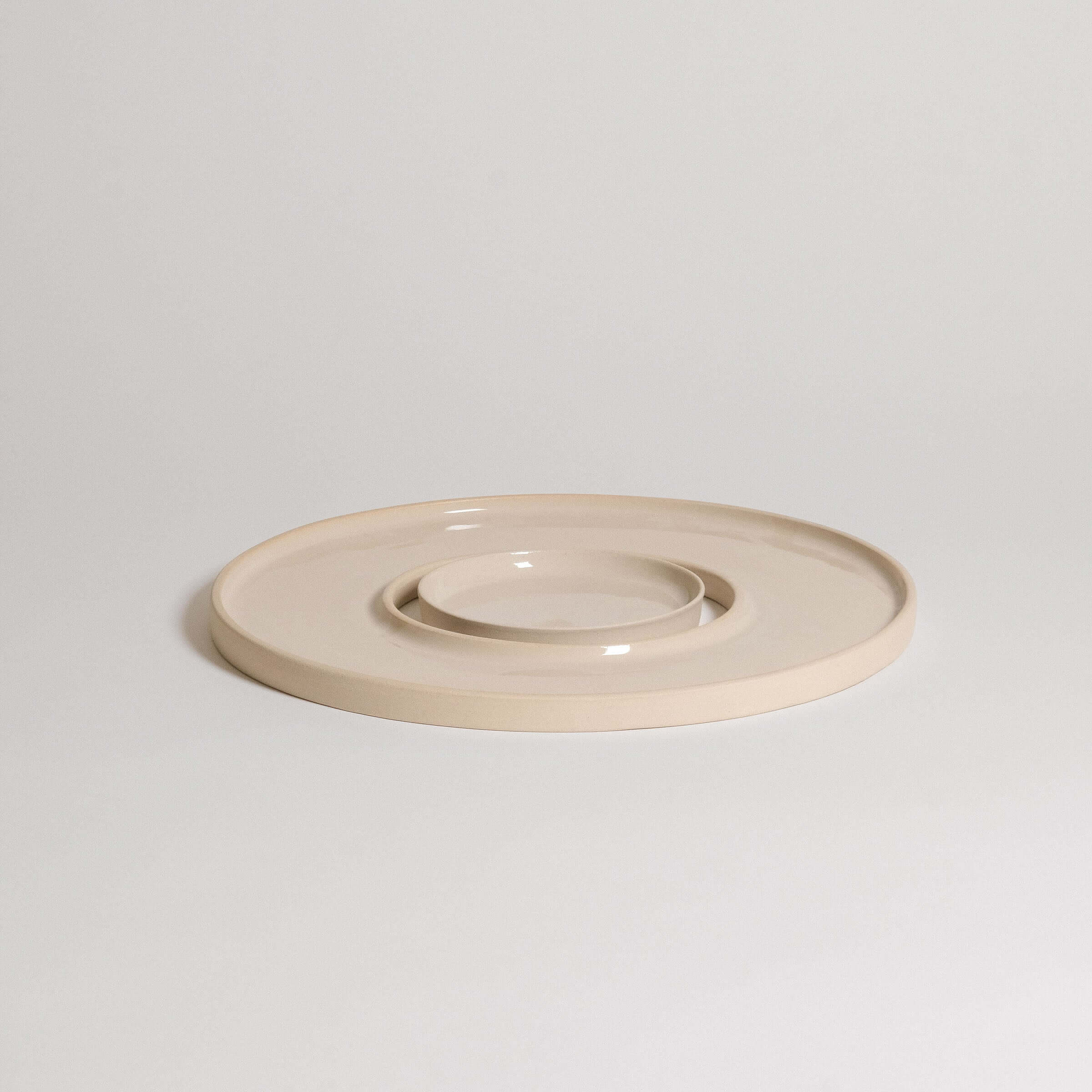 Tapas tray set in creme color made of grey stoneware clay with glossy glaze, ideal for serving appetizers.