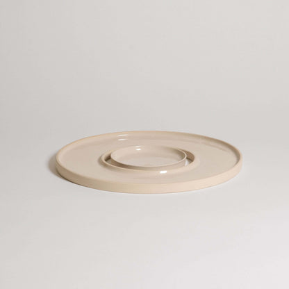 Tapas tray set in creme color made of grey stoneware clay with glossy glaze, ideal for serving appetizers.